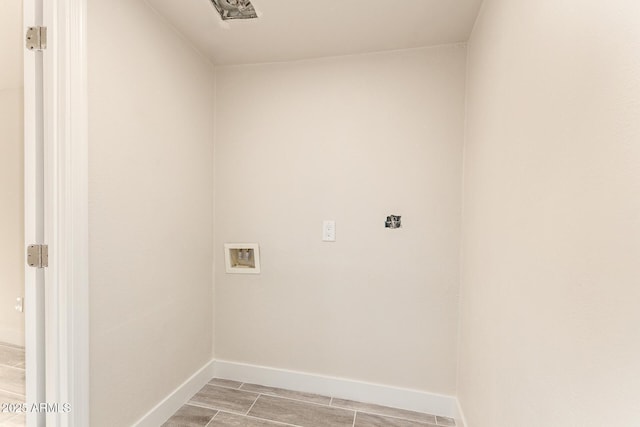 laundry room featuring hookup for a washing machine, wood tiled floor, and baseboards