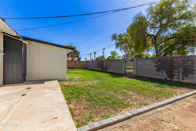 view of yard featuring a gate and fence