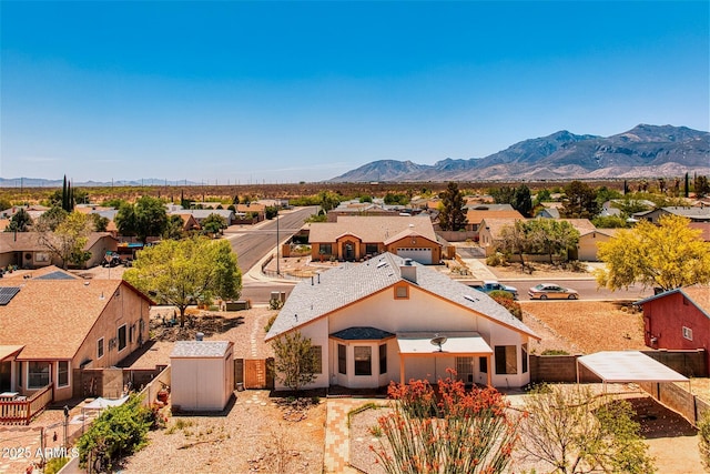 drone / aerial view featuring a residential view and a mountain view