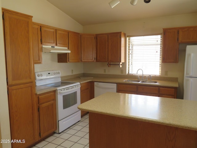 kitchen with a sink, under cabinet range hood, white appliances, and light countertops