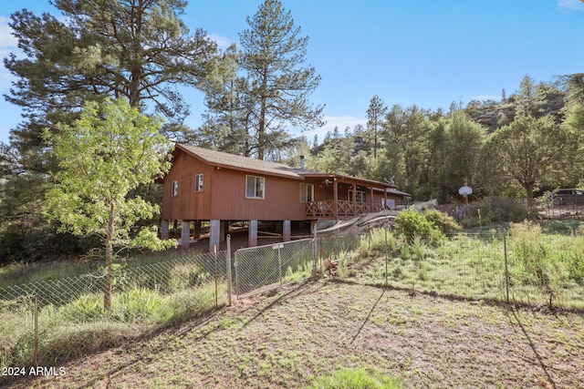 rear view of property featuring a carport