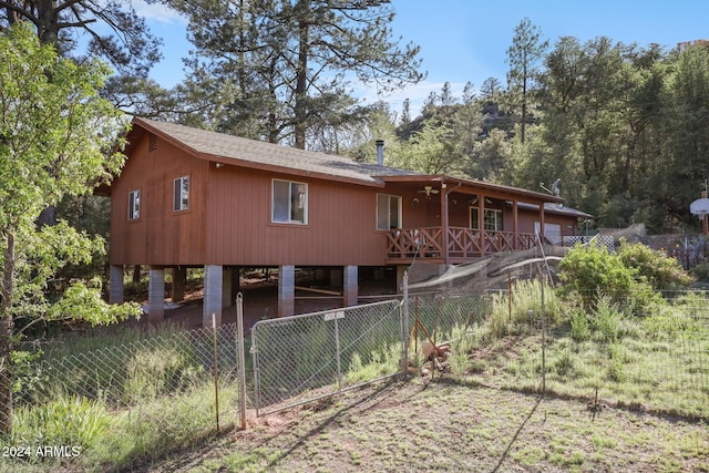 back of property featuring a carport