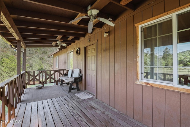 wooden terrace featuring ceiling fan