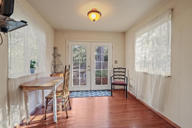 entryway with hardwood / wood-style floors and french doors