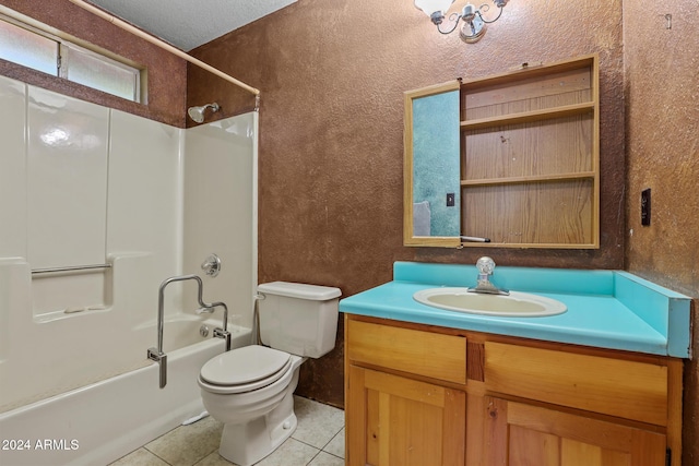 full bathroom with bathing tub / shower combination, vanity, a textured ceiling, tile patterned flooring, and toilet