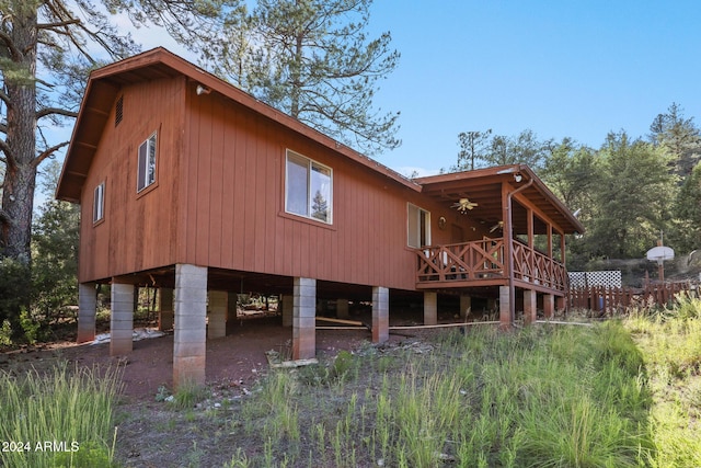 rear view of property featuring a deck