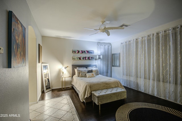 bedroom with hardwood / wood-style flooring and ceiling fan