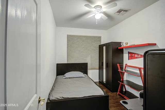 bedroom featuring dark wood-type flooring and ceiling fan