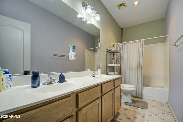 full bathroom featuring shower / bathtub combination with curtain, vanity, tile patterned flooring, and toilet