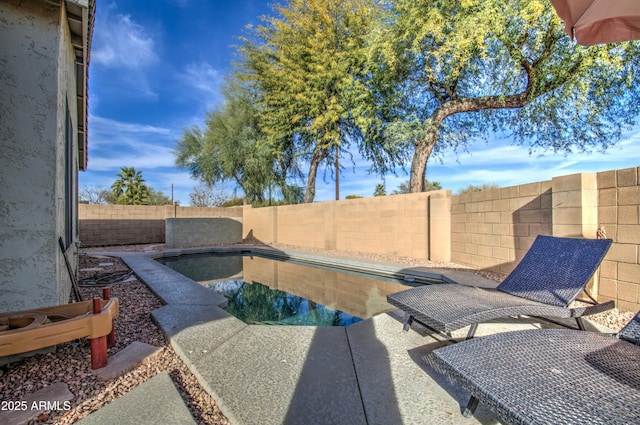 view of patio / terrace featuring a fenced in pool