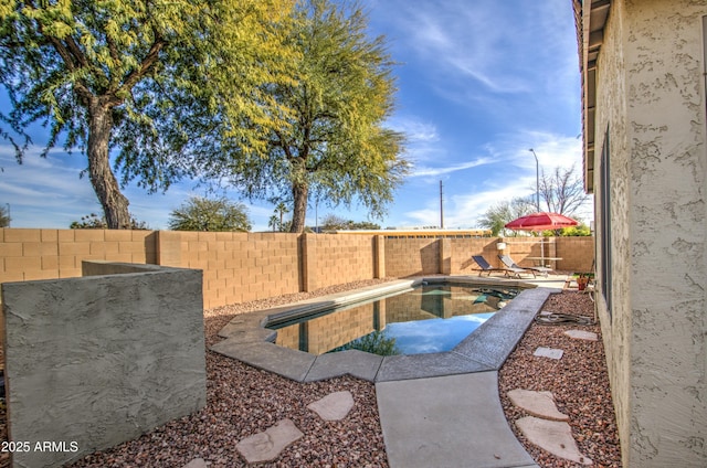 view of patio / terrace featuring a fenced in pool