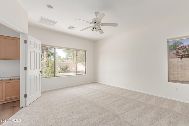 2140 S Benton Cir, Mesa, AZ 85209 - unfurnished bedroom featuring light carpet, multiple windows, and baseboards