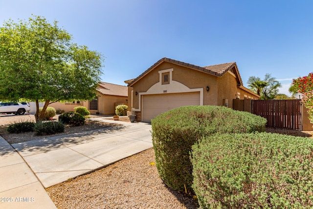 2140 S Benton Cir, Mesa, AZ 85209 - view of front facade with fence, stucco siding, an attached garage, and concrete driveway