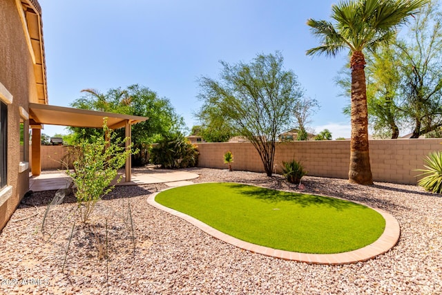 2140 S Benton Cir, Mesa, AZ 85209 - fenced backyard featuring a patio and a putting green