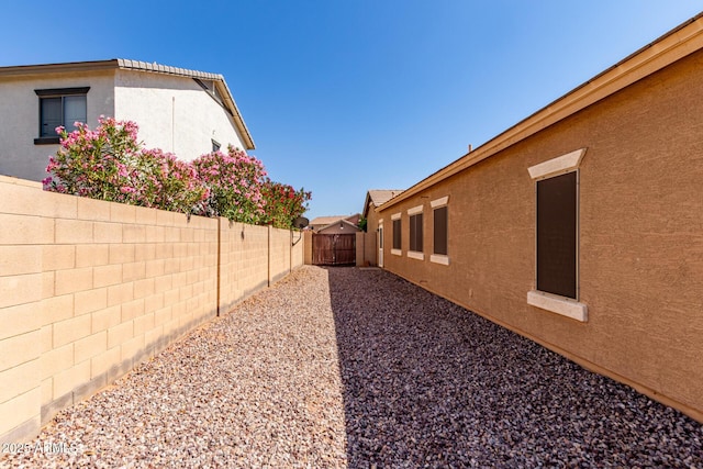 2140 S Benton Cir, Mesa, AZ 85209 - view of side of home with stucco siding and a fenced backyard