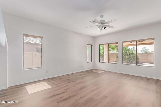 2140 S Benton Cir, Mesa, AZ 85209 - spare room with light wood-style flooring, a ceiling fan, and baseboards