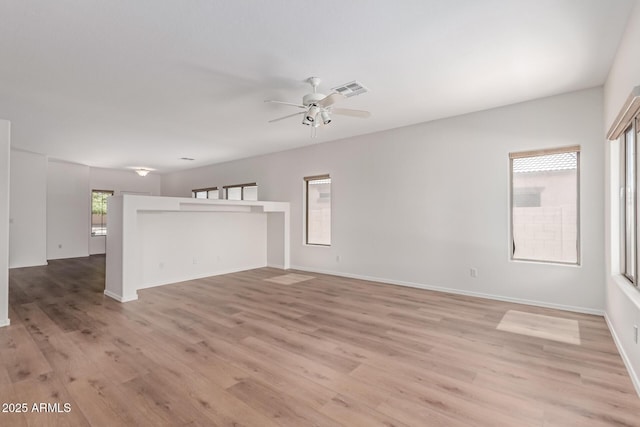 2140 S Benton Cir, Mesa, AZ 85209 - unfurnished living room featuring light wood-type flooring, ceiling fan, and baseboards