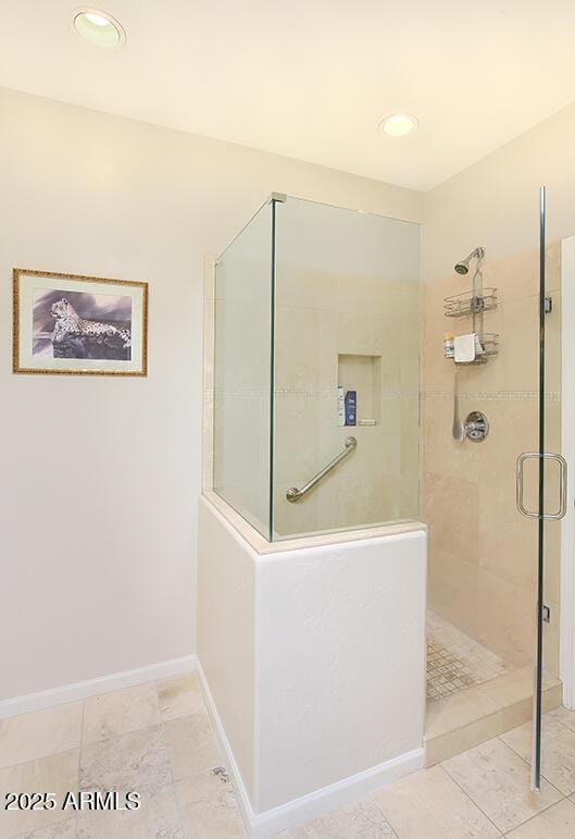 10068 E Cinnabar Ave, Scottsdale, AZ 85258 - bathroom featuring baseboards, tiled shower, and recessed lighting