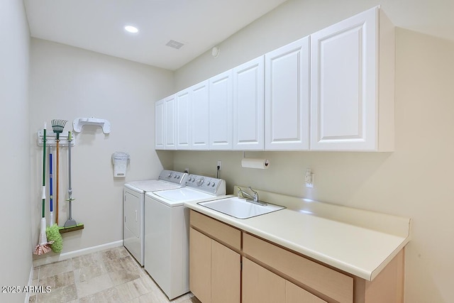 10068 E Cinnabar Ave, Scottsdale, AZ 85258 - washroom featuring visible vents, recessed lighting, washing machine and dryer, a sink, and cabinet space