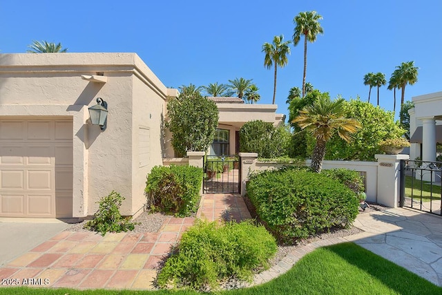 10068 E Cinnabar Ave, Scottsdale, AZ 85258 - view of front of house featuring a garage, a gate, stucco siding, and fence