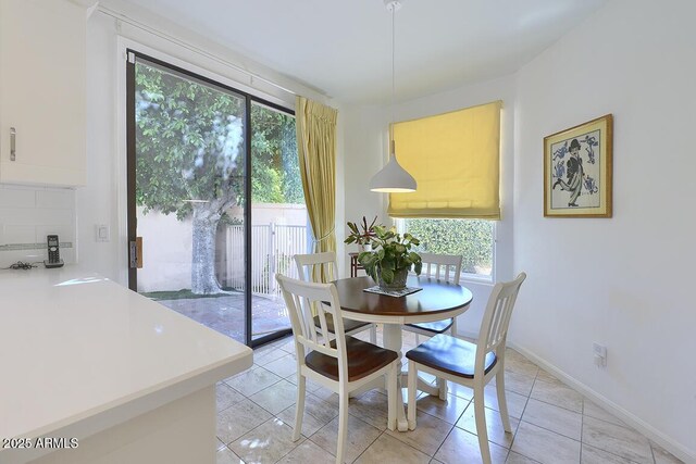 10068 E Cinnabar Ave, Scottsdale, AZ 85258 - dining area featuring baseboards and light tile patterned floors