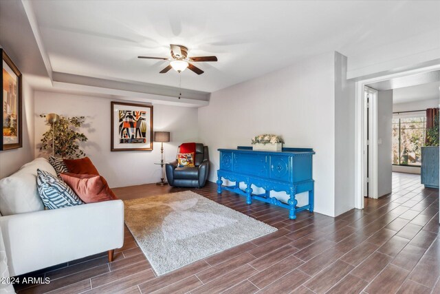 living area featuring hardwood / wood-style flooring and ceiling fan