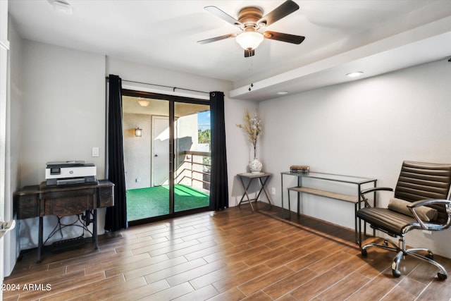 sitting room with hardwood / wood-style flooring and ceiling fan