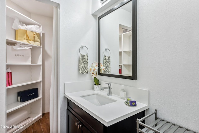 bathroom featuring hardwood / wood-style flooring and vanity