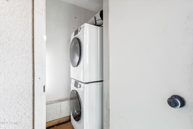 laundry room with stacked washer and dryer