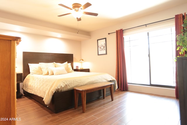 bedroom with hardwood / wood-style flooring and ceiling fan