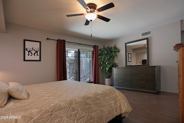 bedroom with ceiling fan and dark hardwood / wood-style flooring