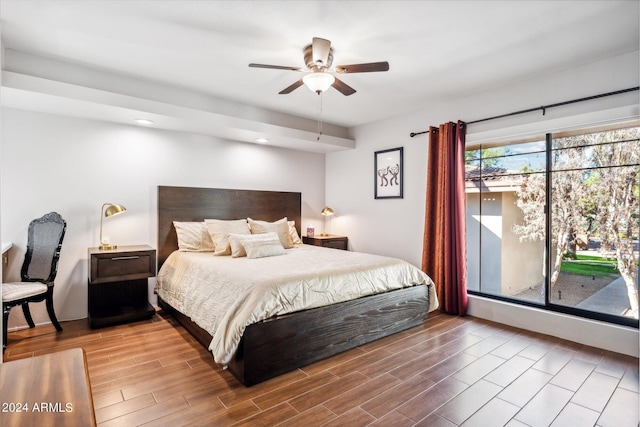 bedroom with hardwood / wood-style flooring and ceiling fan