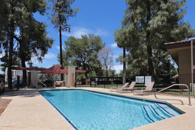 view of swimming pool with a patio