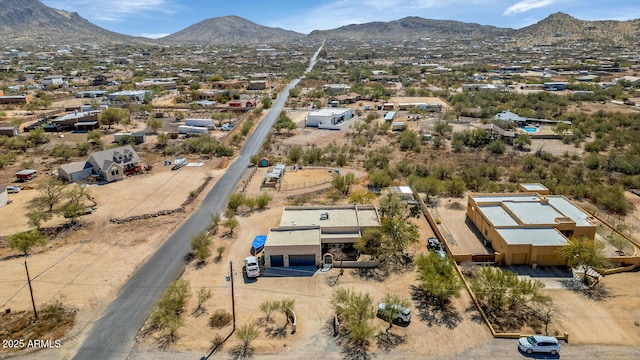 birds eye view of property featuring a mountain view