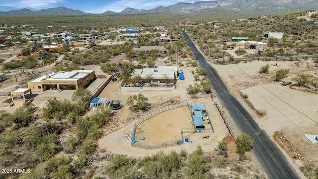 birds eye view of property with a desert view and a mountain view