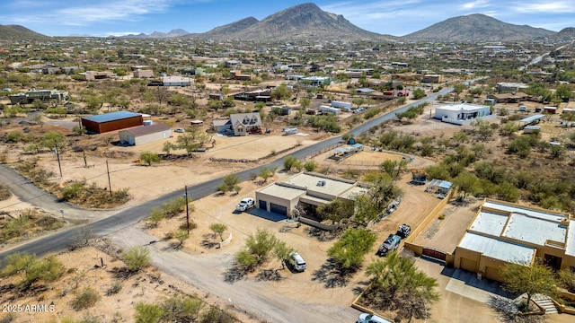 birds eye view of property featuring a mountain view