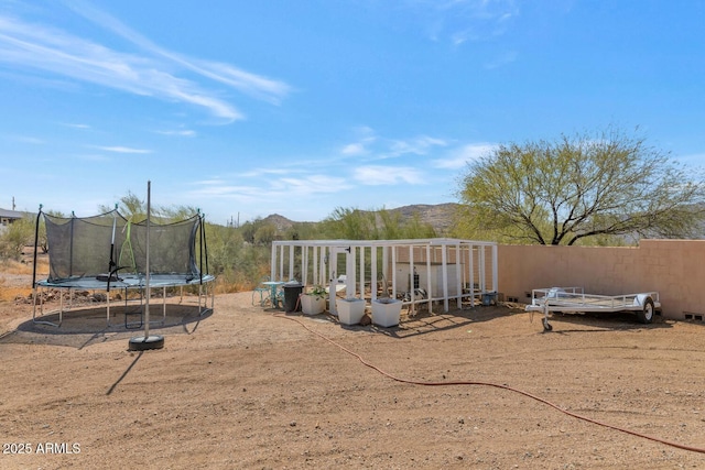 view of yard with a trampoline