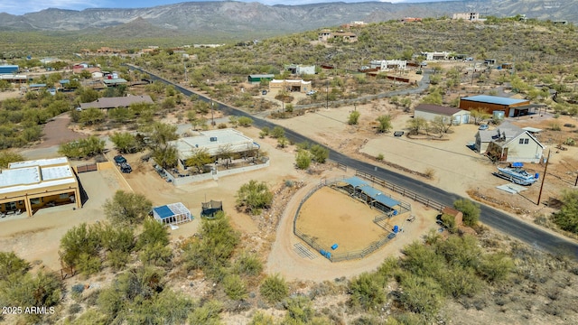 birds eye view of property with a mountain view