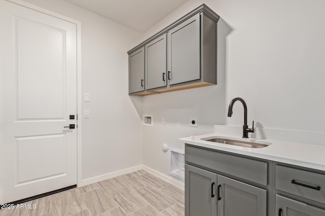 laundry area featuring cabinets, hookup for a gas dryer, washer hookup, electric dryer hookup, and sink