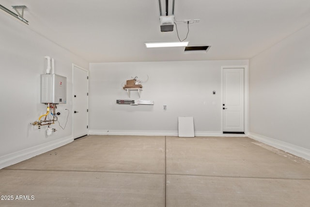 garage with tankless water heater and a garage door opener