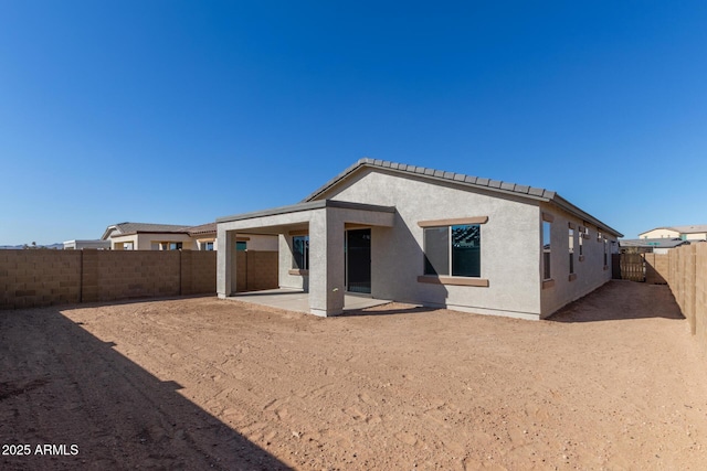 rear view of house featuring a patio area