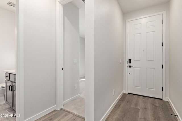 doorway to outside featuring light hardwood / wood-style floors