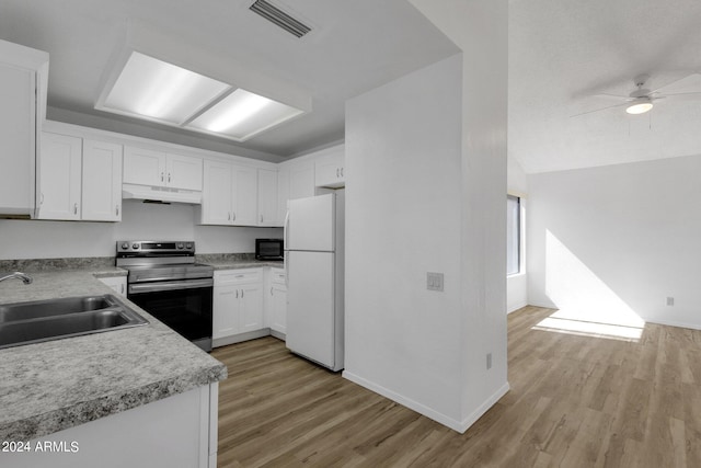 kitchen featuring white cabinets, white refrigerator, stainless steel range with electric stovetop, sink, and light hardwood / wood-style floors