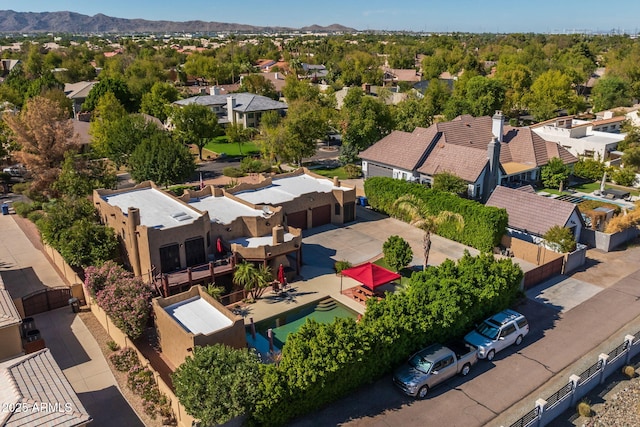 drone / aerial view featuring a residential view and a mountain view