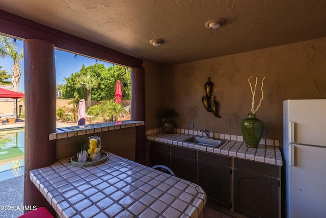 view of patio / terrace featuring a sink