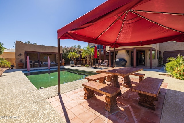 outdoor pool with a patio and fence