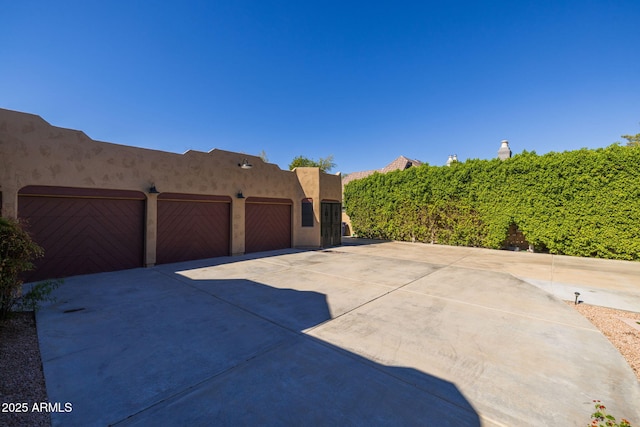 exterior space with driveway and a garage