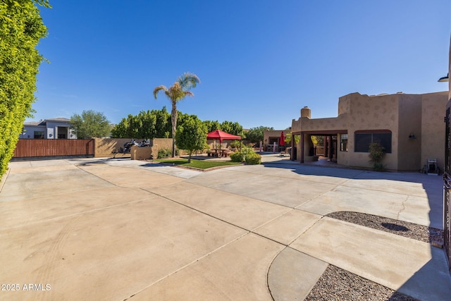 exterior space with fence and a patio area