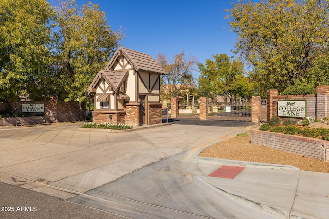 exterior space with fence and a gate