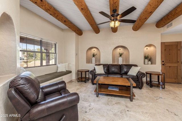 living room with visible vents, a ceiling fan, wooden ceiling, and beamed ceiling